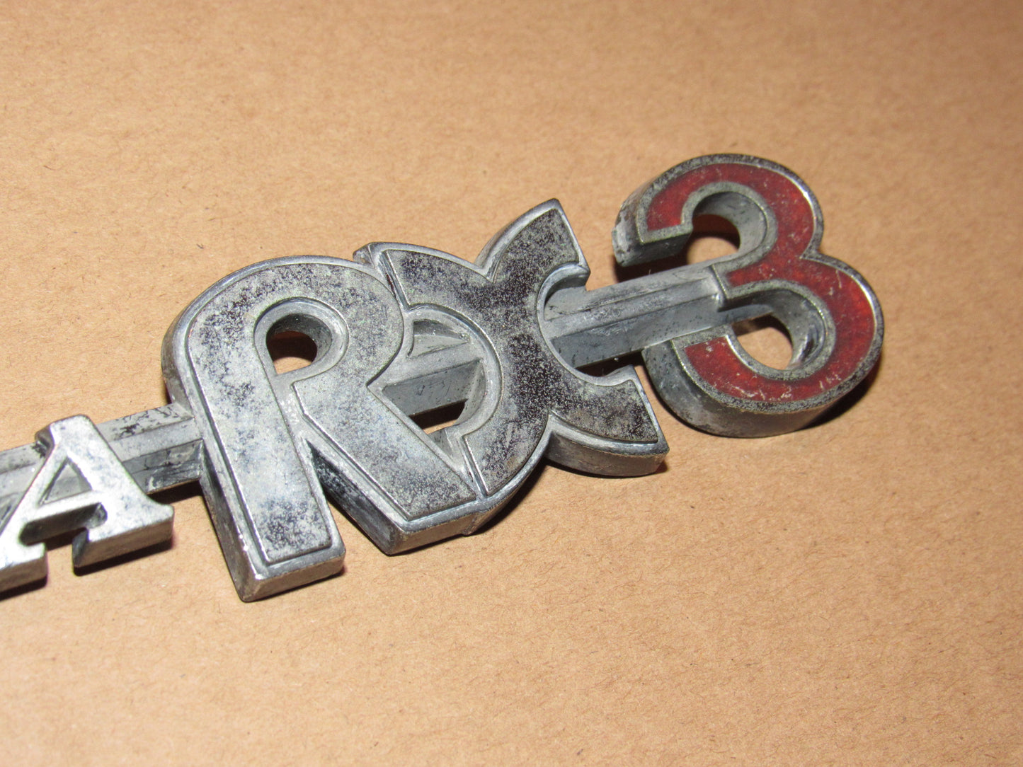 72-78 Mazda RX3 OEM Rear Quarter Panel Badge Emblem