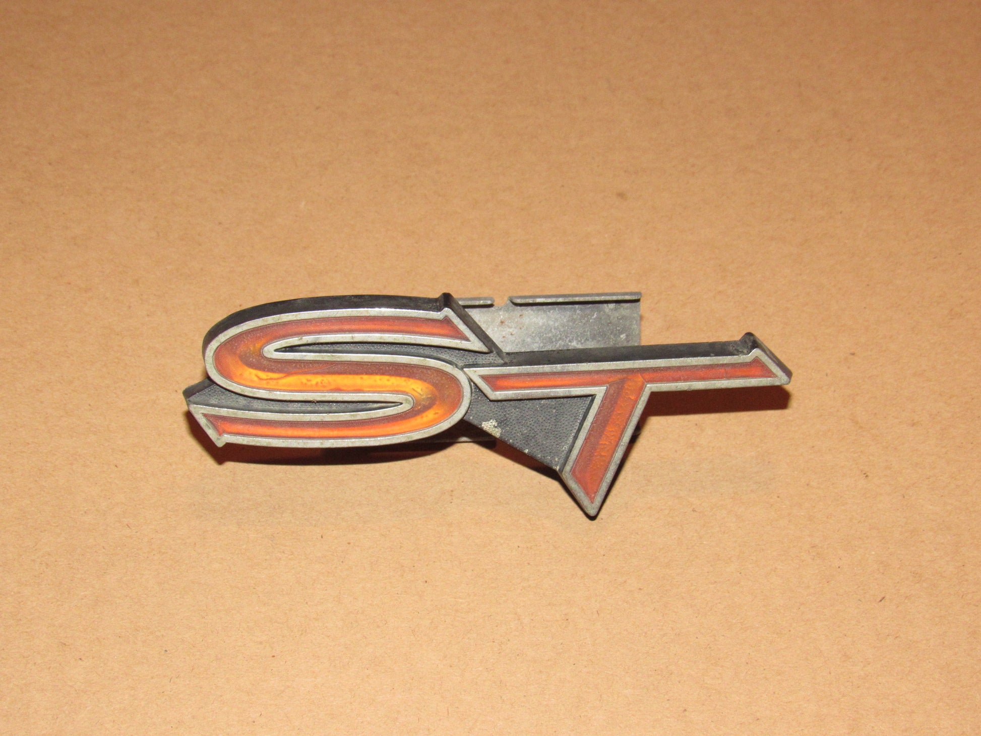 76-77 Toyota Celica OEM Front Grille ST Emblem Badge