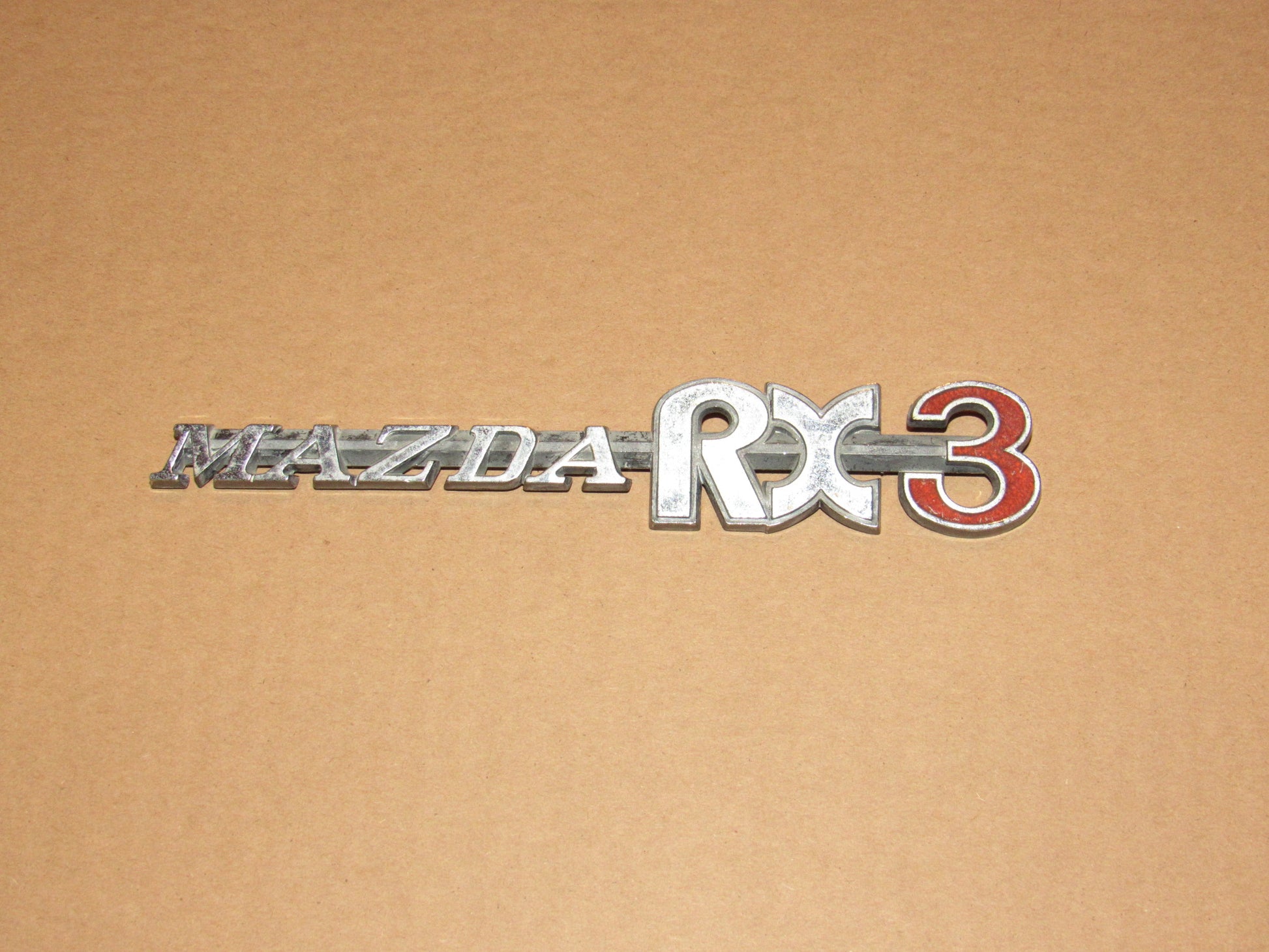 72-78 Mazda RX3 OEM Rear Quarter Panel Badge Emblem
