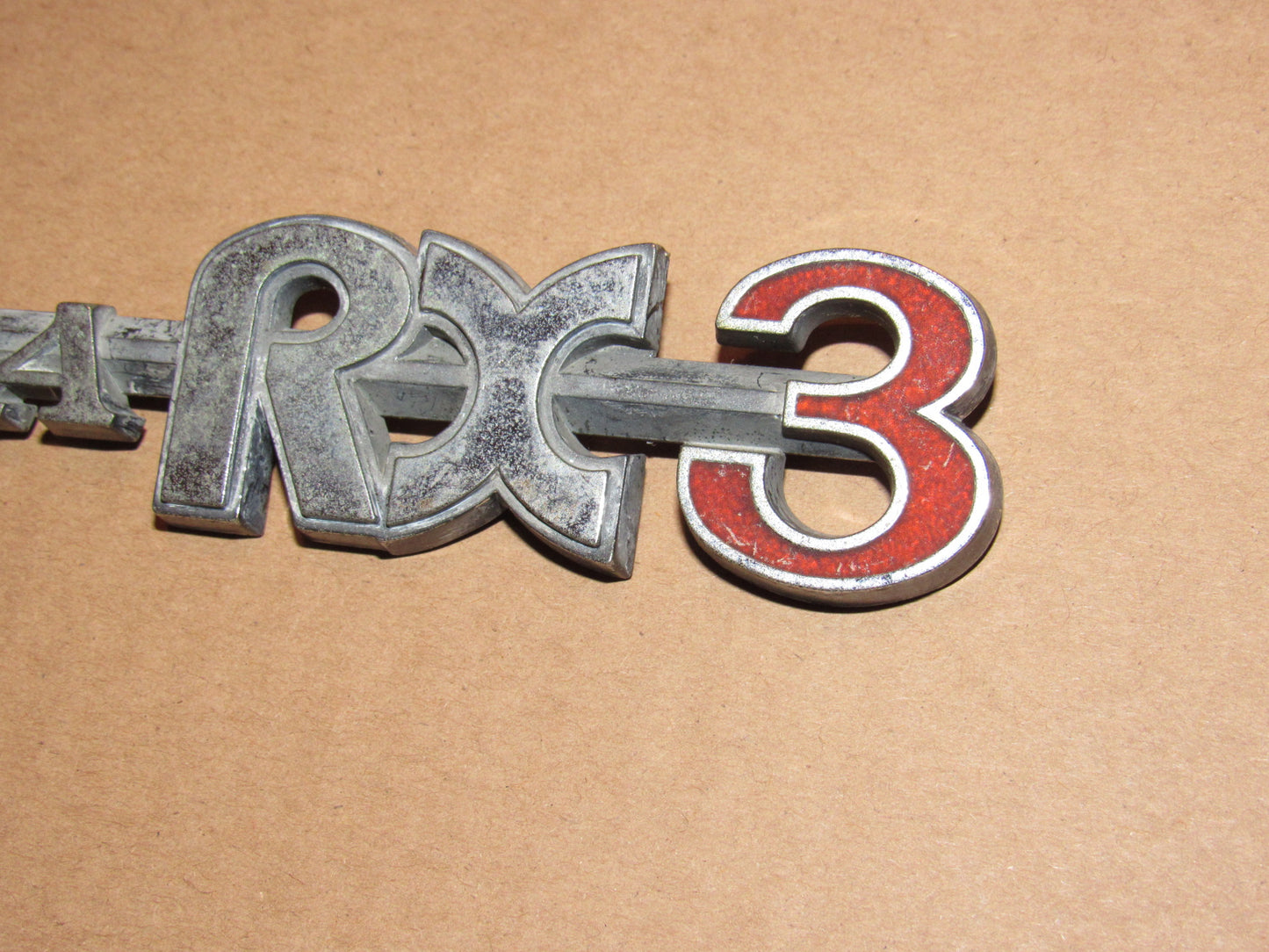 72-78 Mazda RX3 OEM Rear Quarter Panel Badge Emblem